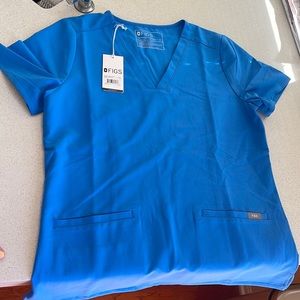 Women’s Capri Blue Casma Three-Pocket scrub top, brand new with tags.